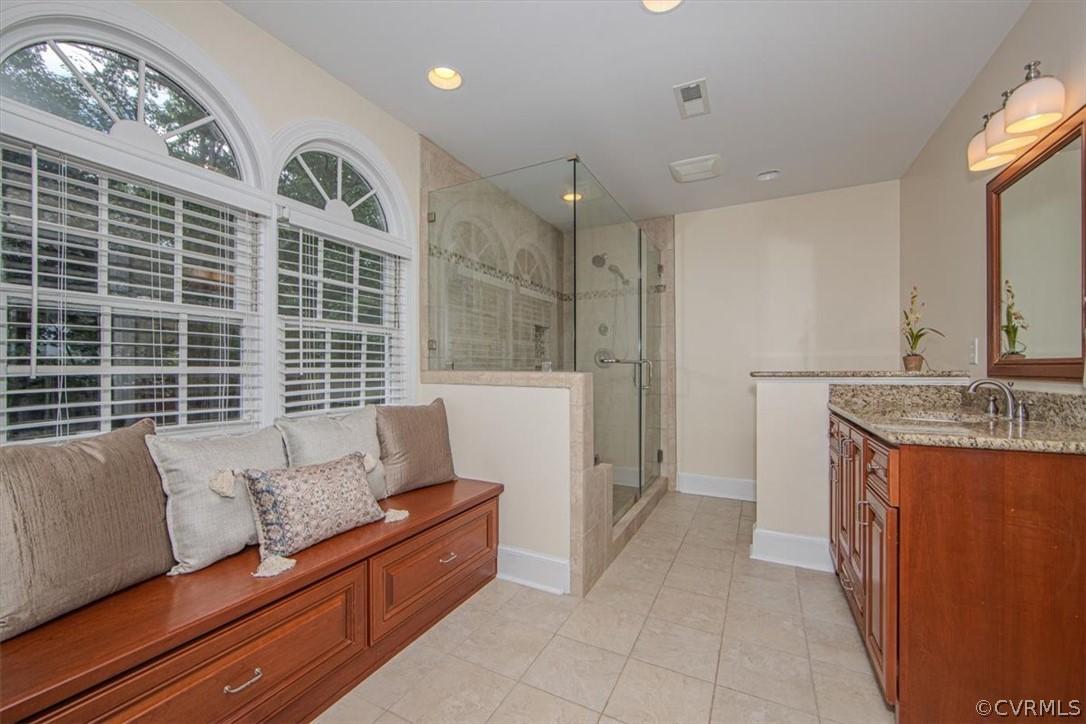 2610 Leafield Terrace Midlothian, VA 23113 - Photo 19 of 40 a bathroom with a tub sink and mirror