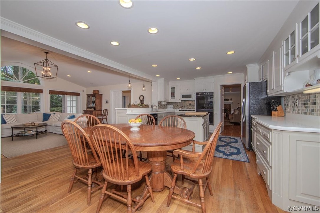 2610 Leafield Terrace Midlothian, VA 23113 - Photo 5 of 40 a view of a dining room with furniture and wooden floor