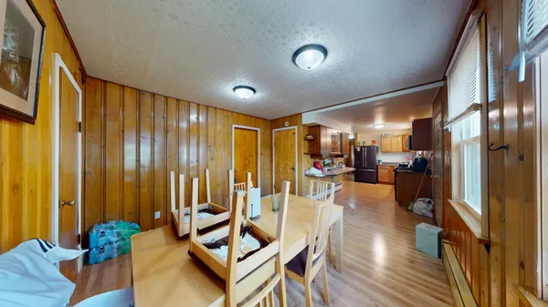 a view of a livingroom with furniture and hardwood floor