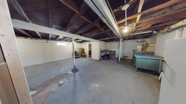 a view of storage and utility room with stairs