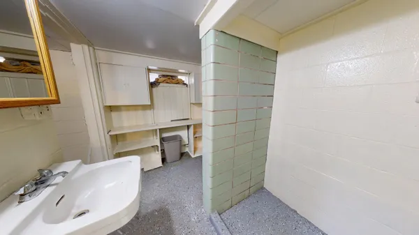 a bathroom with a sink and mirror