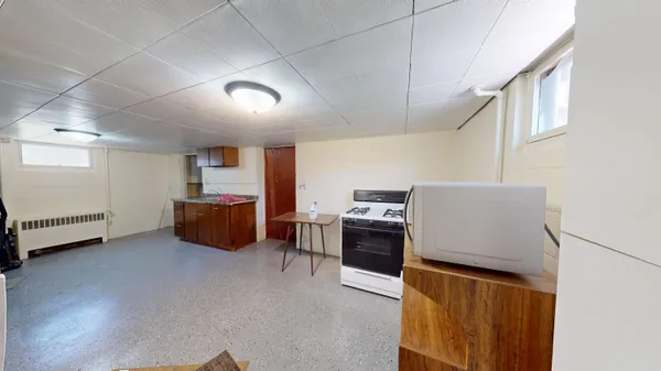 a room with furniture and a flat screen tv