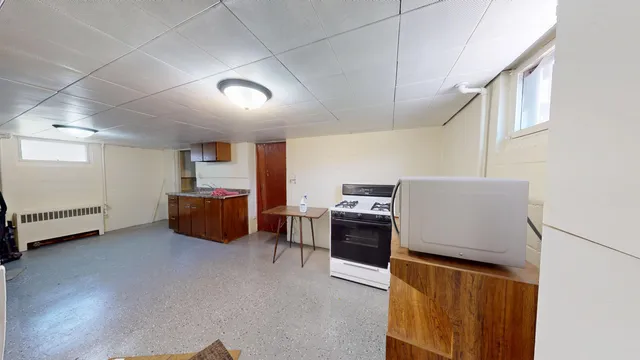 a room with furniture and a flat screen tv