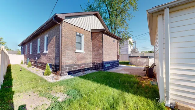 a backyard of a house with seating space
