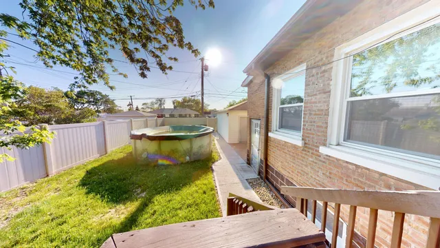 a view of a balcony with two chairs