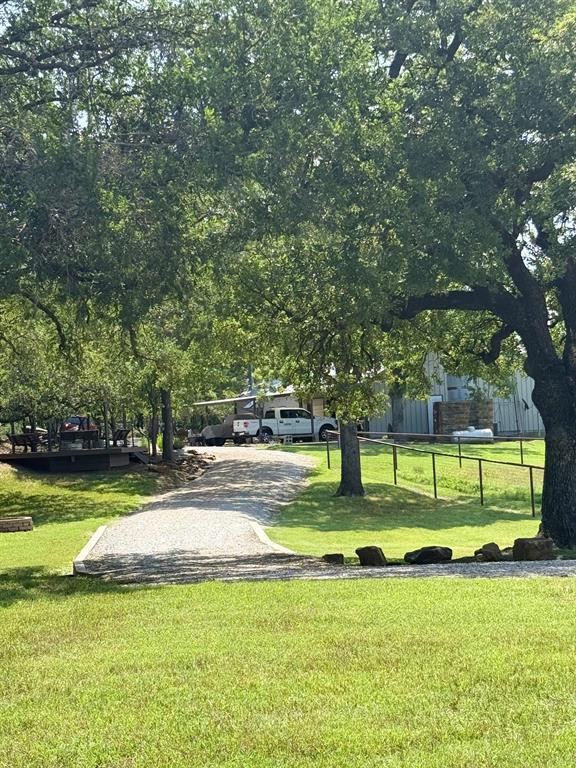1079 Union Hill Road Mineral Wells, TX 76067 - Photo 11 of 40 a view of a swimming pool with a big yard