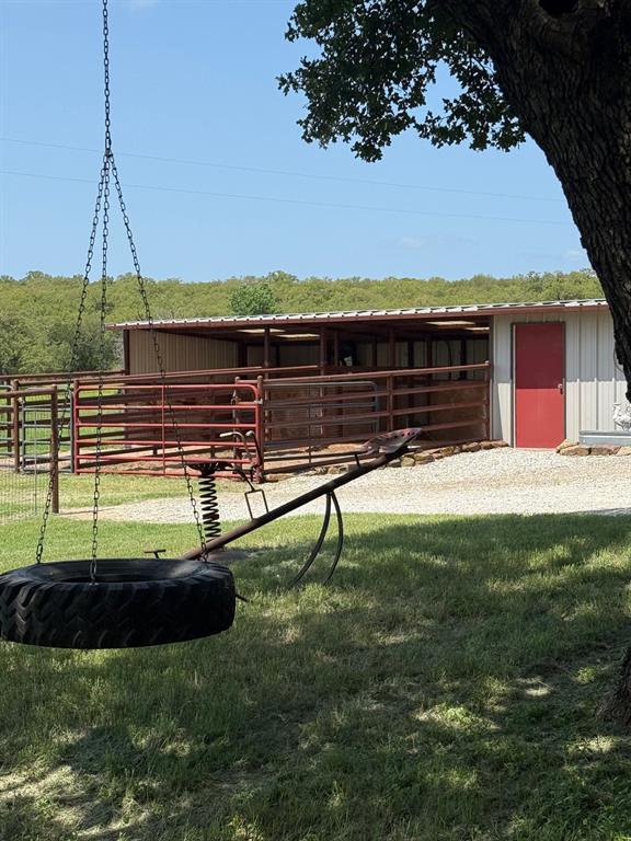 1079 Union Hill Road Mineral Wells, TX 76067 - Photo 13 of 40 a view of swimming pool with a table and chairs