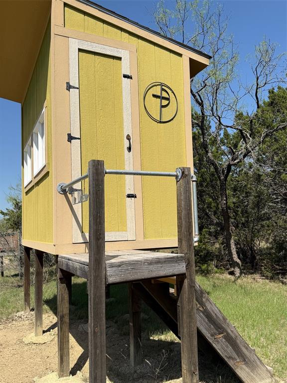 1079 Union Hill Road Mineral Wells, TX 76067 - Photo 17 of 40 a view of a door with wooden fence