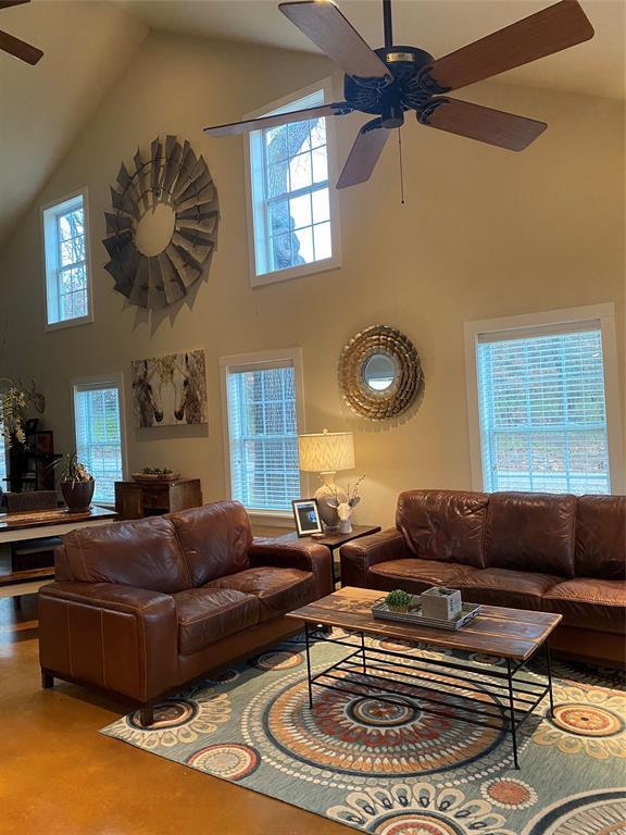 1079 Union Hill Road Mineral Wells, TX 76067 - Photo 26 of 40 a living room with furniture and a chandelier