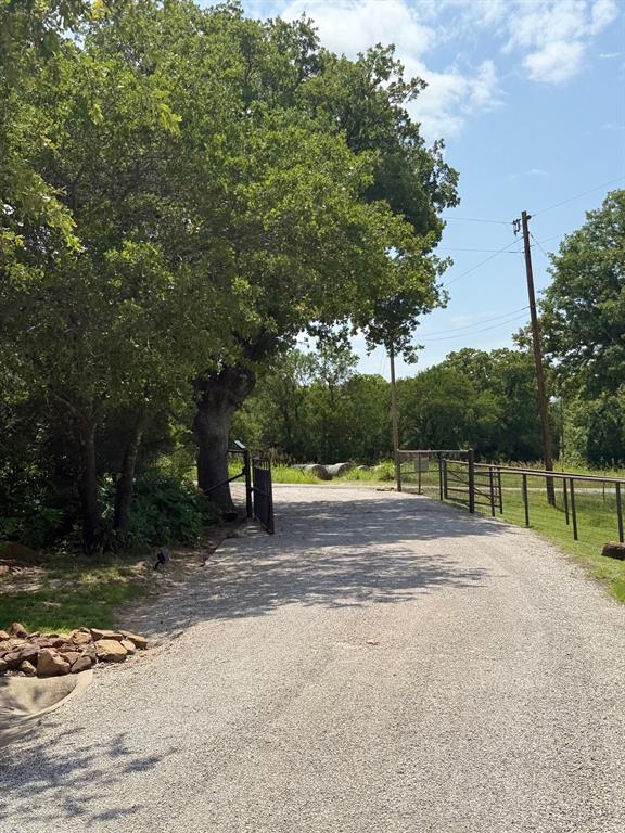 1079 Union Hill Road Mineral Wells, TX 76067 - Photo 6 of 40 a view of backyard with tree