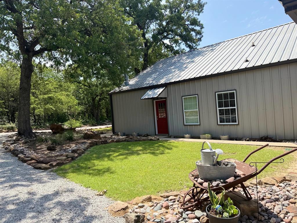 1079 Union Hill Road Mineral Wells, TX 76067 - Photo 8 of 40 a backyard of a house with table and chairs