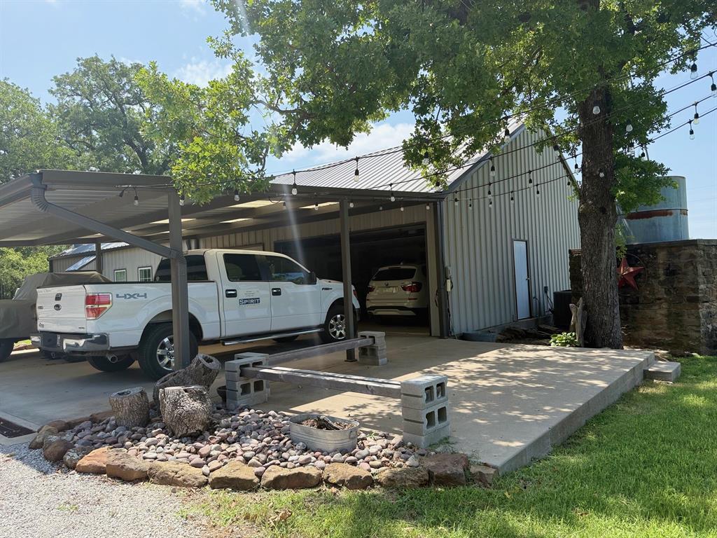 1079 Union Hill Road Mineral Wells, TX 76067 - Photo 9 of 40 a car parked in front of a house
