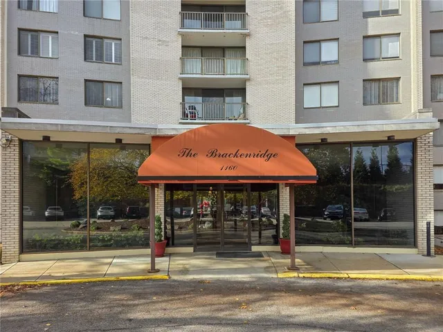a view of a brick building with a large windows