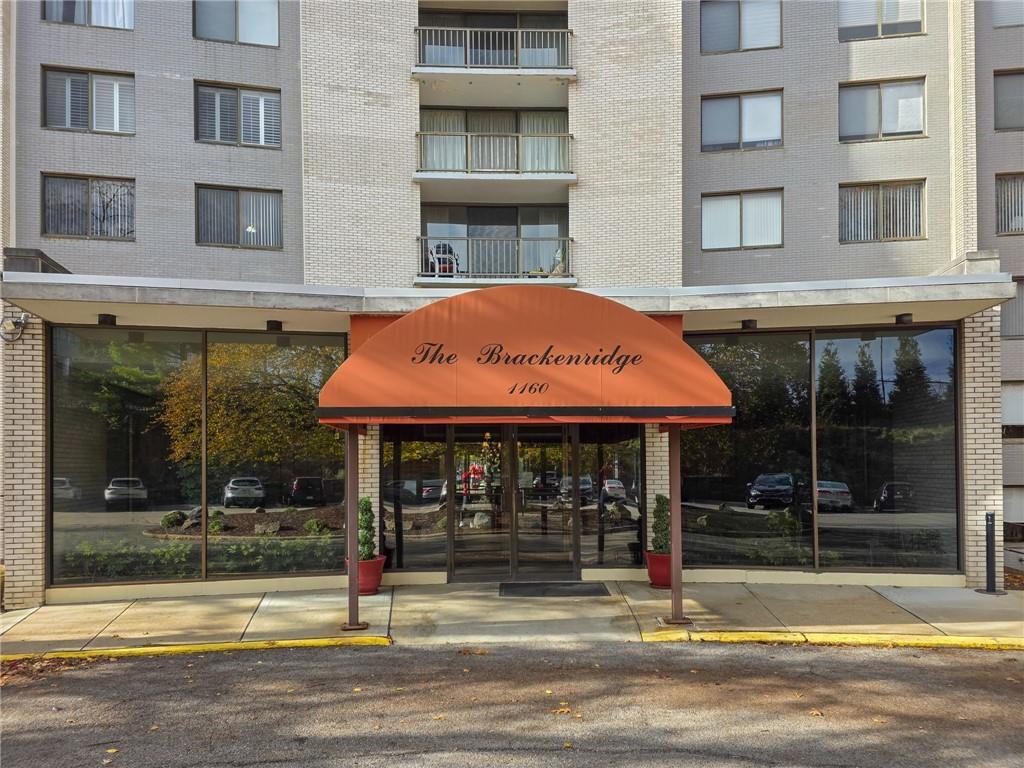 a view of a brick building with a large windows
