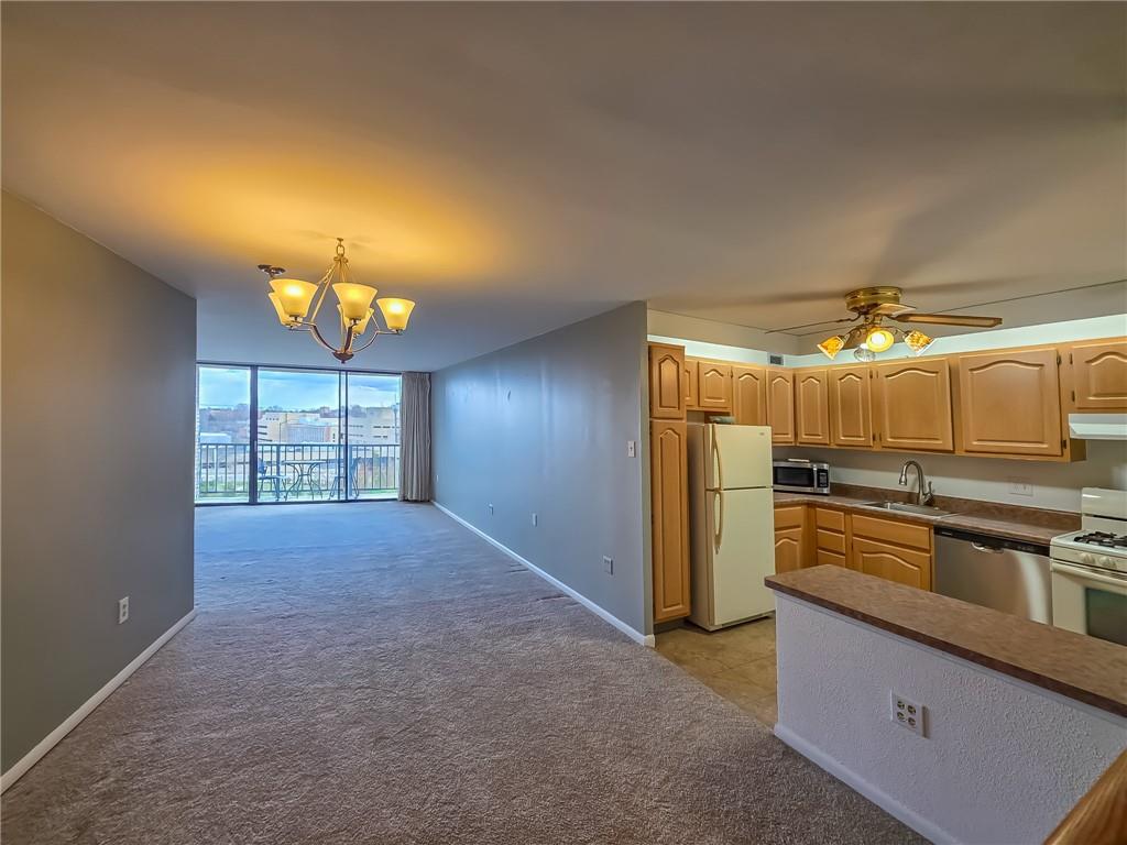 1160 Bower Hill Road, Unit 700C Pittsburgh, PA 15243 - Photo 11 of 35 a view of a kitchen with a sink and refrigerator