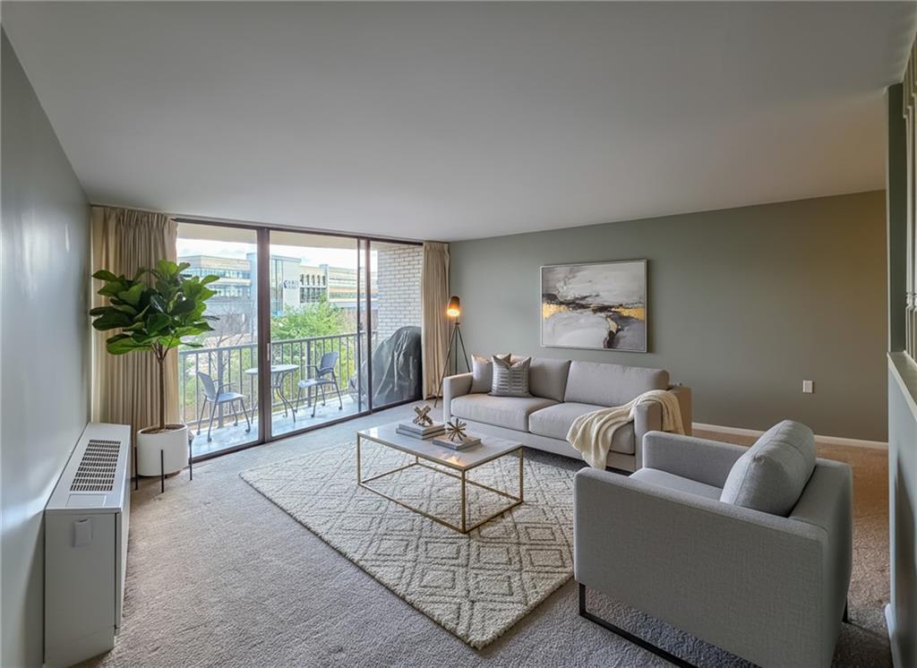 1160 Bower Hill Road, Unit 700C Pittsburgh, PA 15243 - Photo 18 of 35 a living room with furniture and a floor to ceiling window