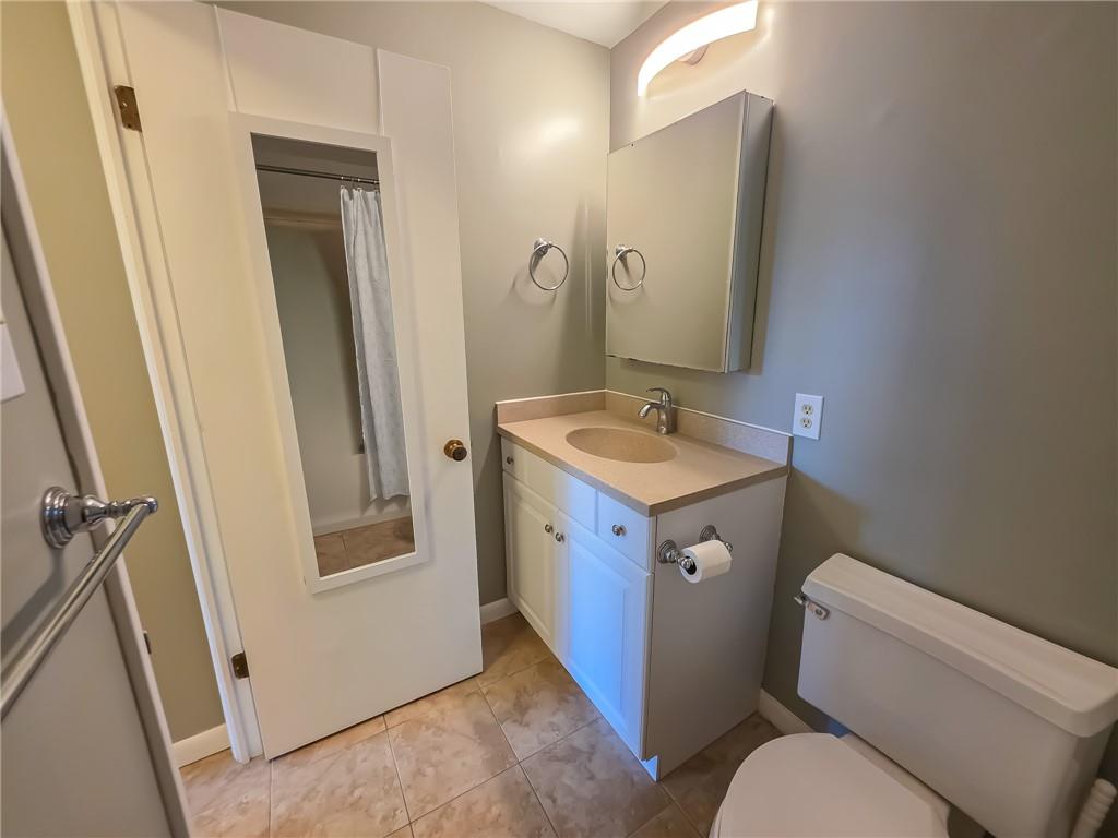 1160 Bower Hill Road, Unit 700C Pittsburgh, PA 15243 - Photo 25 of 35 a bathroom with a sink a toilet a mirror and vanity