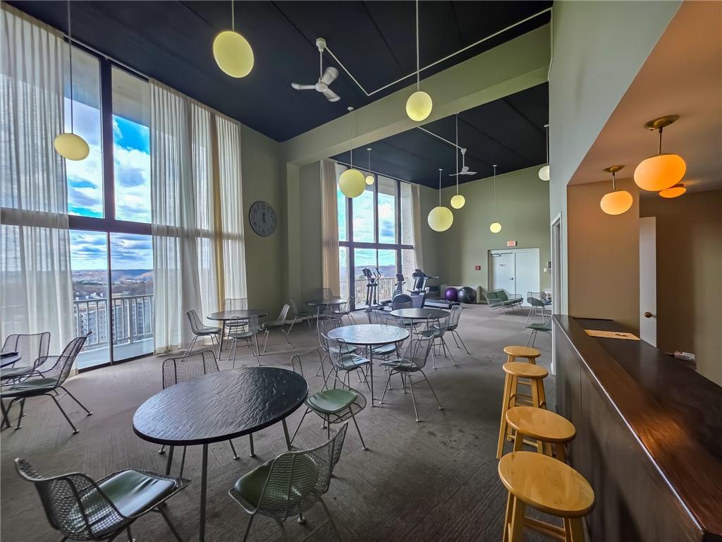 1160 Bower Hill Road, Unit 700C Pittsburgh, PA 15243 - Photo 30 of 35 a room with lots of tables a large window and chairs