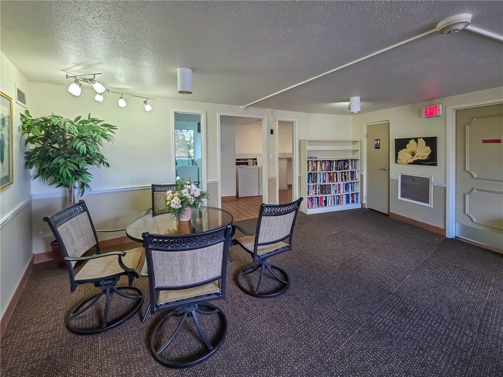 1160 Bower Hill Road, Unit 700C Pittsburgh, PA 15243 - Photo 31 of 35 a living room with furniture a dining table and kitchen view