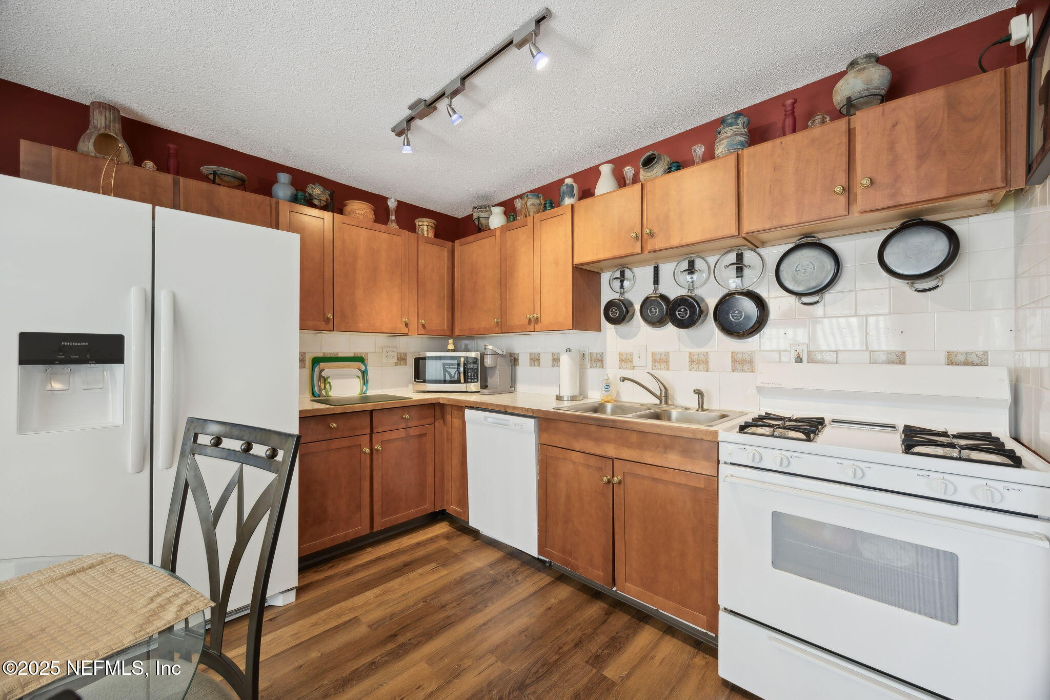 259 South Prospect Street Crescent City, FL 32112 - Photo 11 of 63 a kitchen with stainless steel appliances granite countertop a stove and a refrigerator