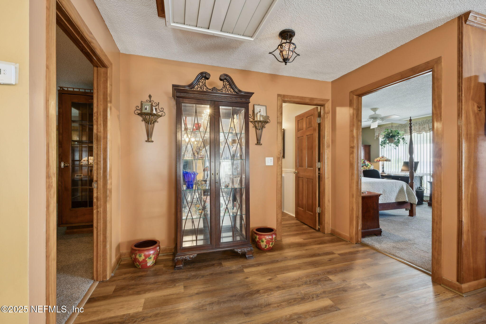 259 South Prospect Street Crescent City, FL 32112 - Photo 18 of 63 a view of a hallway to a livingroom and a livingroom with furniture