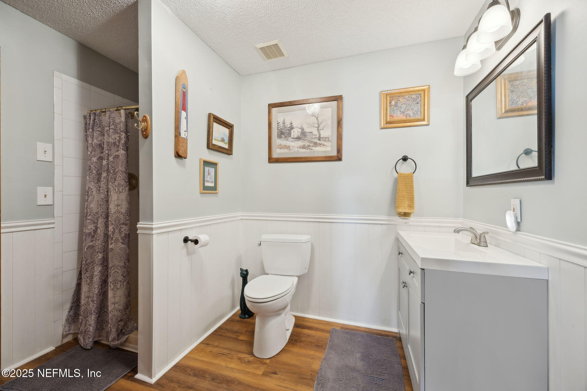 259 South Prospect Street Crescent City, FL 32112 - Photo 21 of 63 a bathroom with a toilet sink and mirror