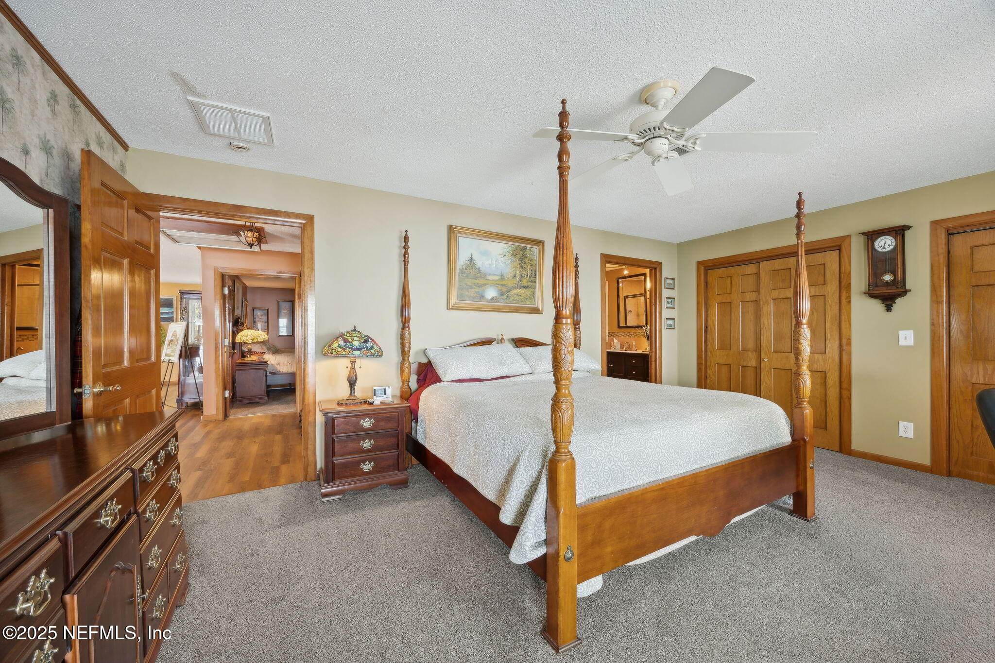 259 South Prospect Street Crescent City, FL 32112 - Photo 23 of 63 a bed room with a bed and a walk in closet