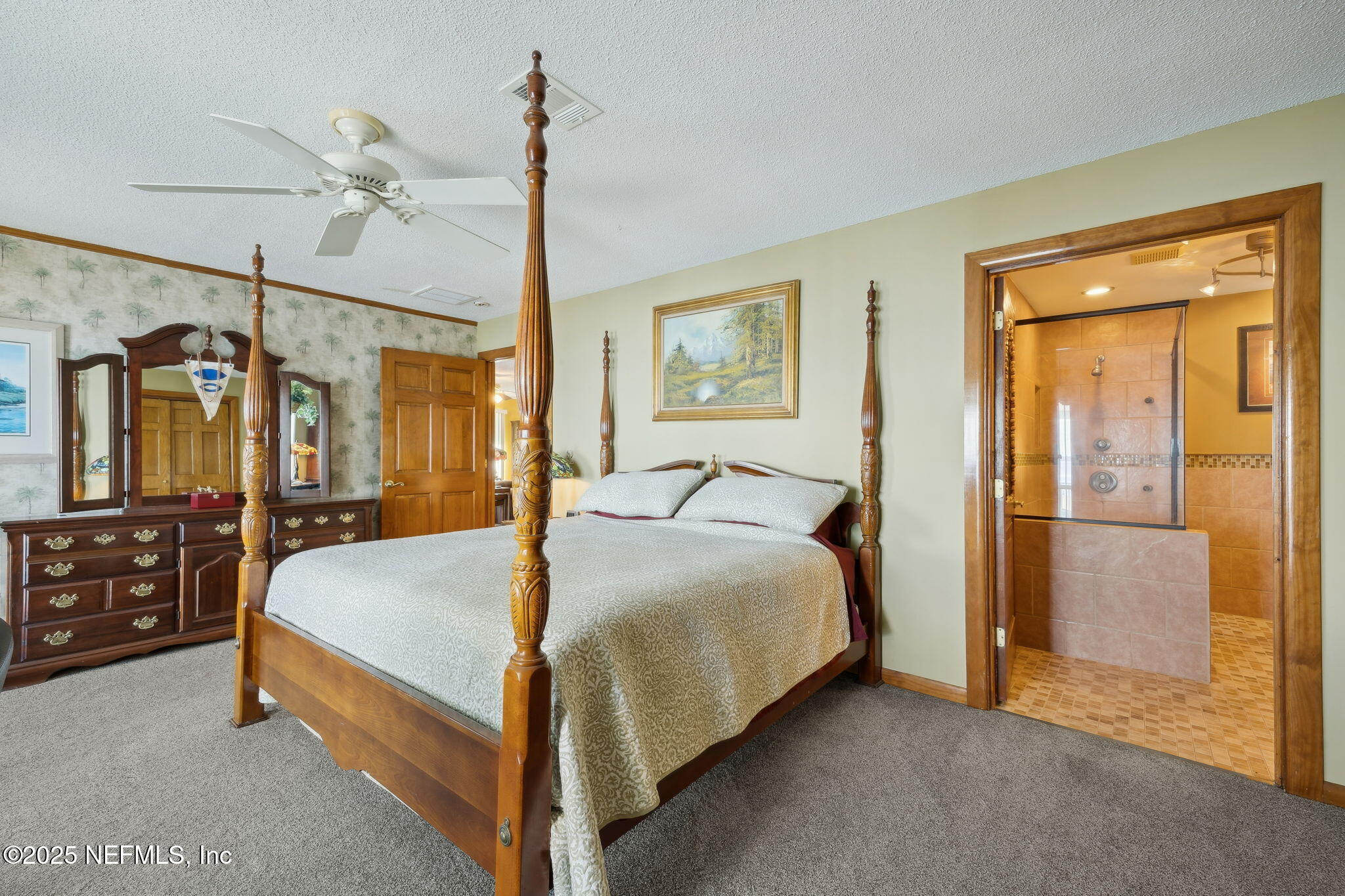259 South Prospect Street Crescent City, FL 32112 - Photo 24 of 63 a bed room with a bed and dresser