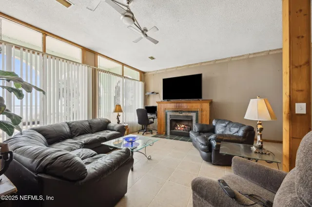 a bedroom with furniture and a chandelier