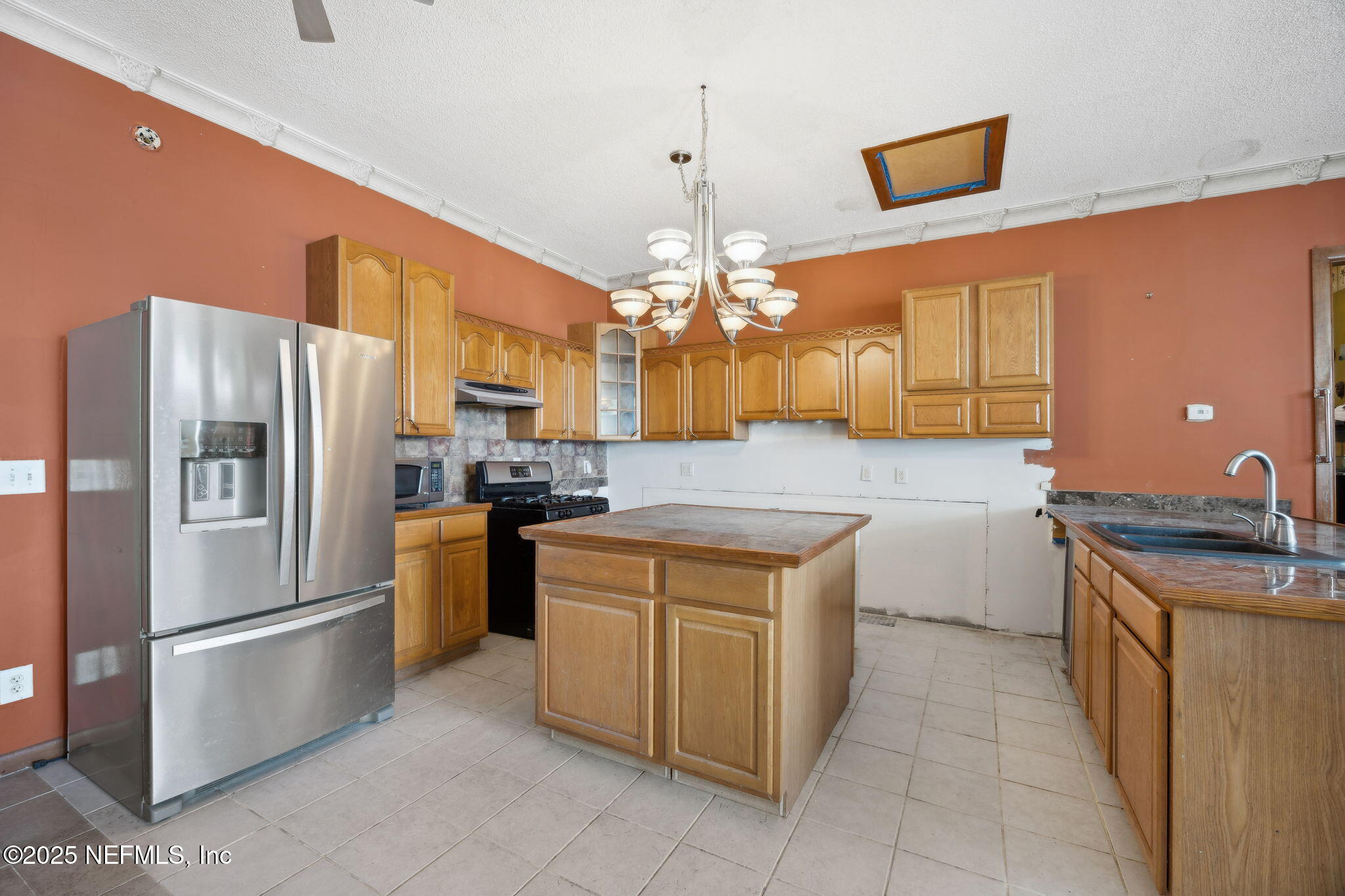 259 South Prospect Street Crescent City, FL 32112 - Photo 34 of 63 a kitchen with a refrigerator sink and stove