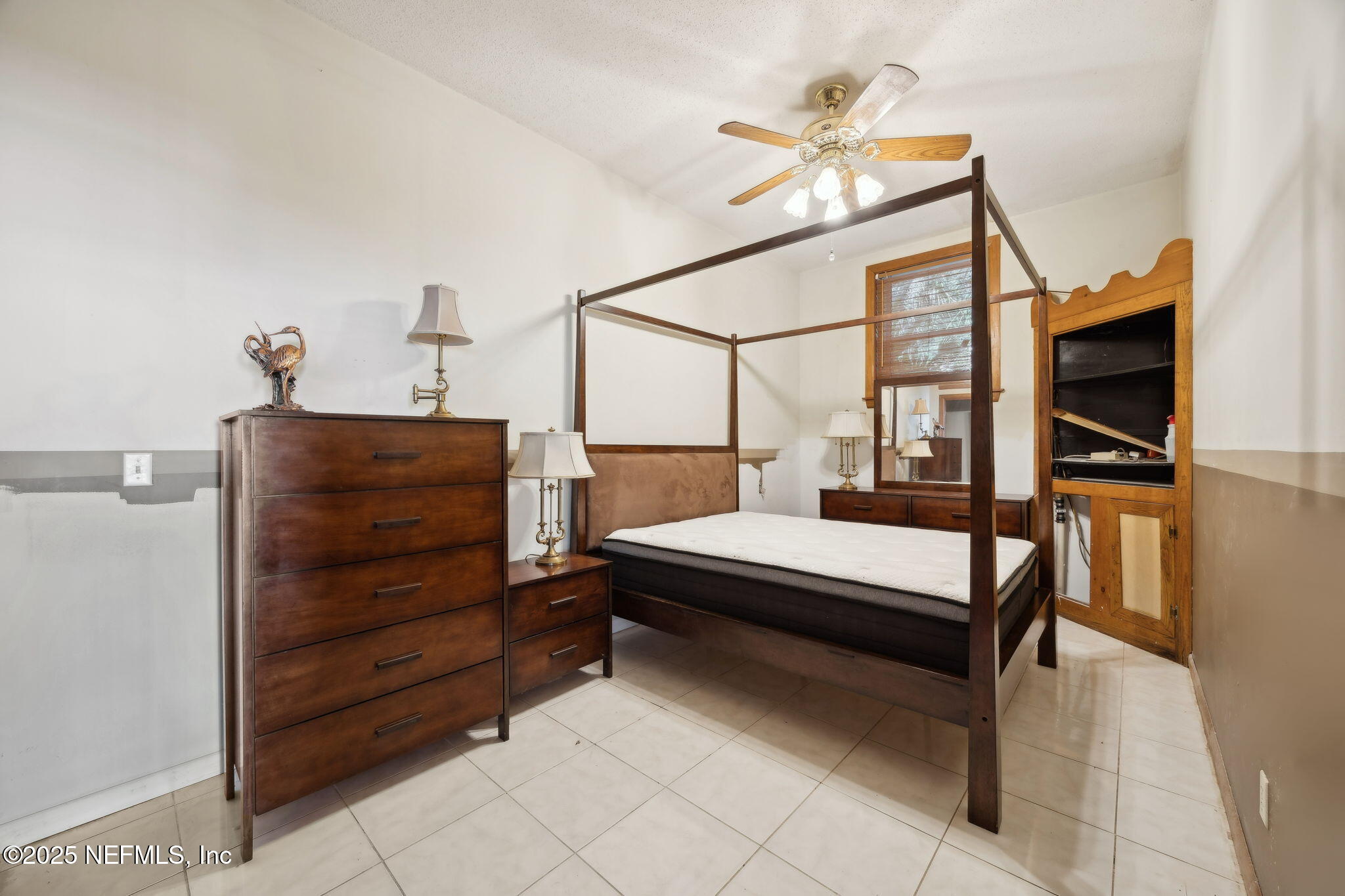 259 South Prospect Street Crescent City, FL 32112 - Photo 36 of 63 a bedroom with furniture and a chandelier