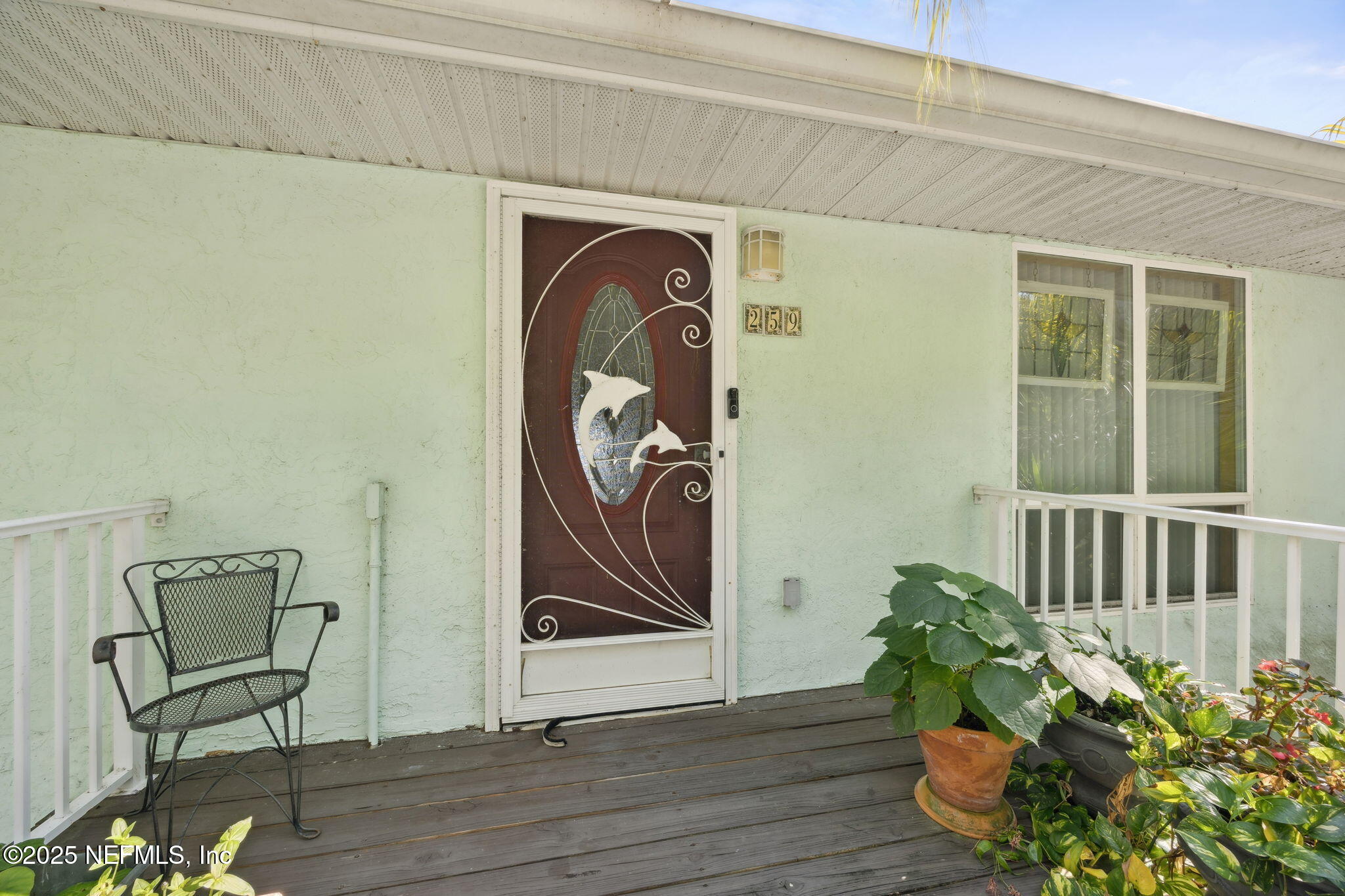 259 South Prospect Street Crescent City, FL 32112 - Photo 4 of 63 a front view of a house with wooden floor and a potted plant