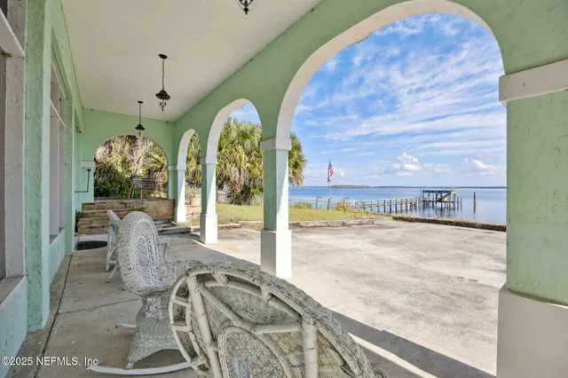 a balcony view with a flat screen tv
