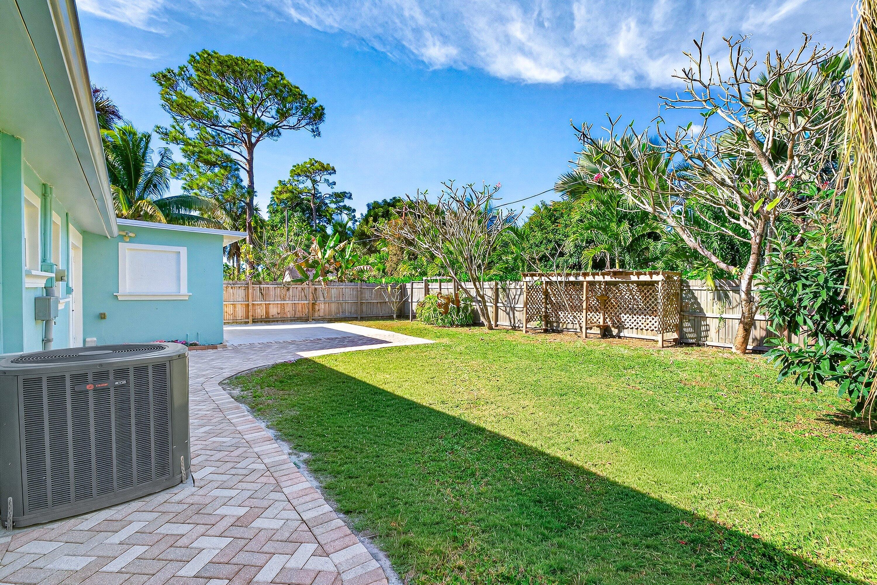5565 Papaya Road Royal Palm Estates, FL 33413 - Photo 29 of 30 a view of a house with a yard