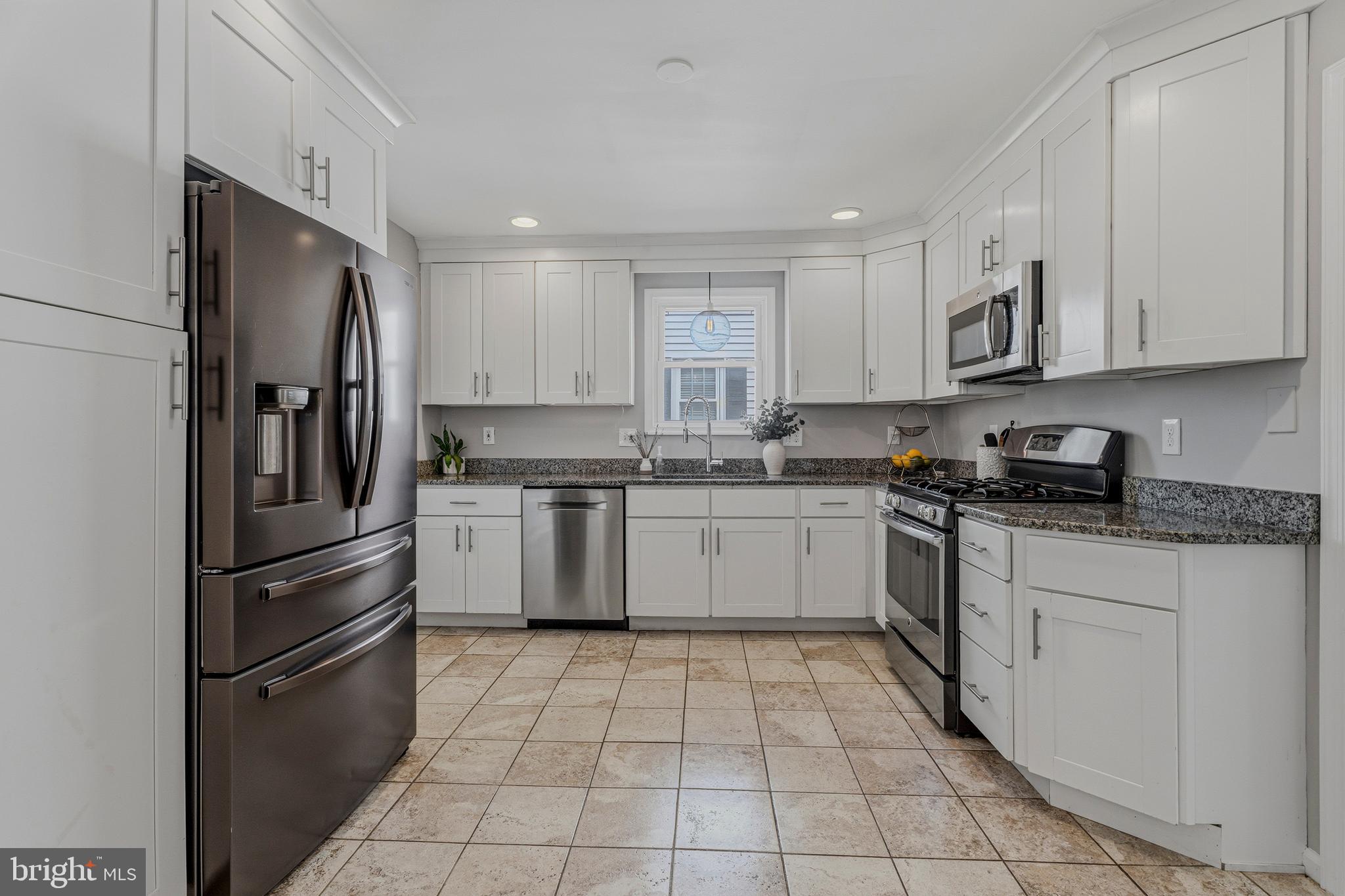 506 Brook Road Baltimore, MD 21286 - Photo 10 of 56 a kitchen with stainless steel appliances granite countertop a refrigerator sink and cabinets