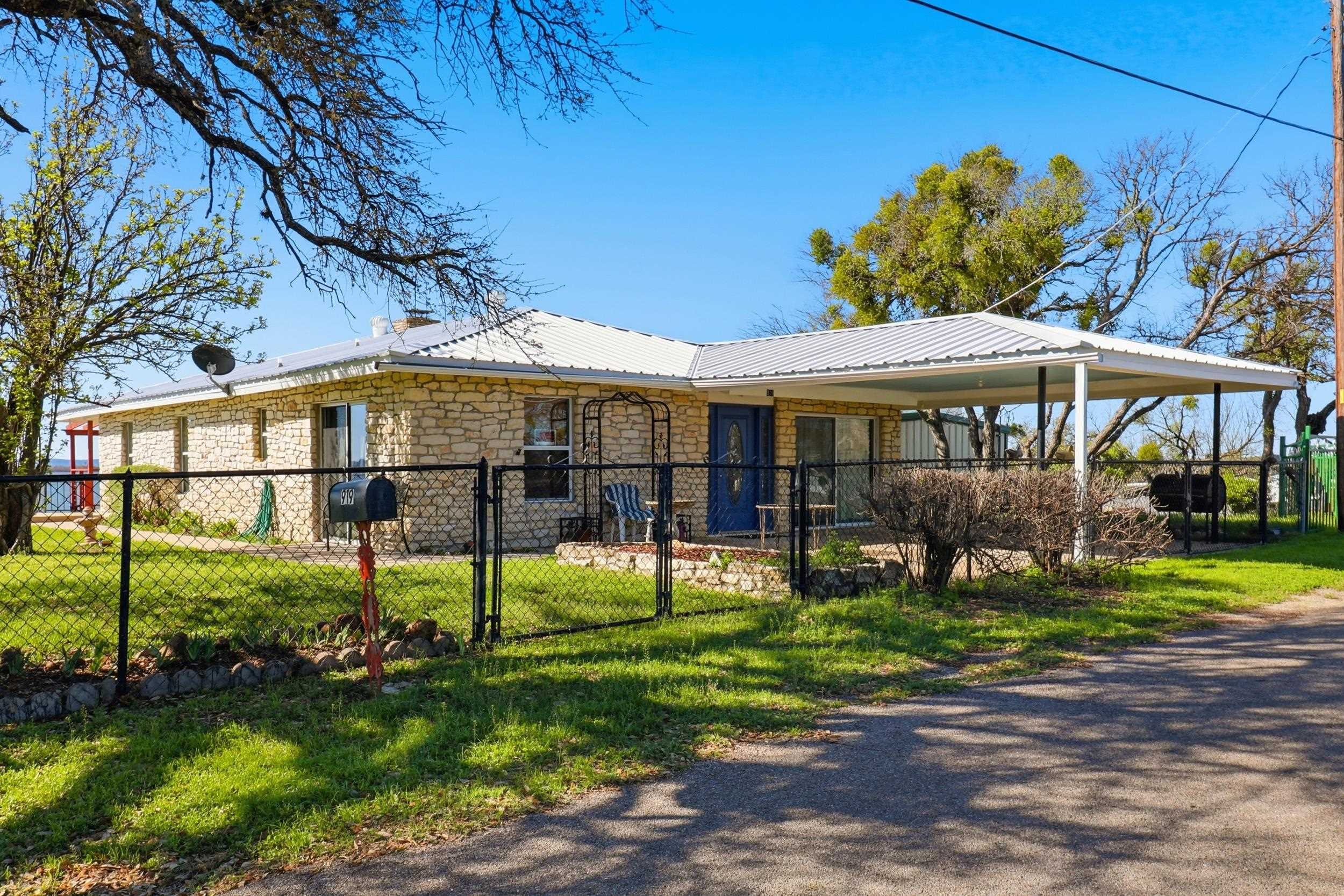 919 Lakeshore Loop Tow, TX 78672 - Photo 2 of 33 a view of a house with a yard