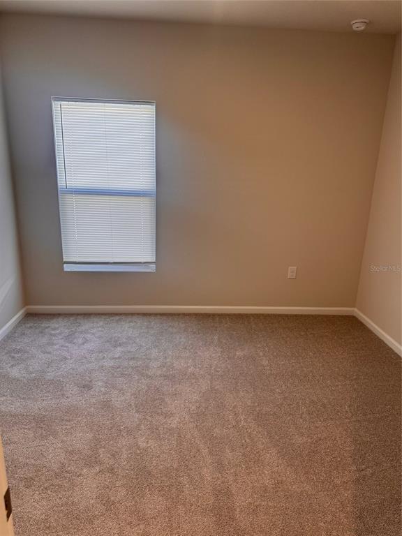 347 Biltmore Boulevard Dundee, FL 33838 - Photo 13 of 18 an empty room with a window