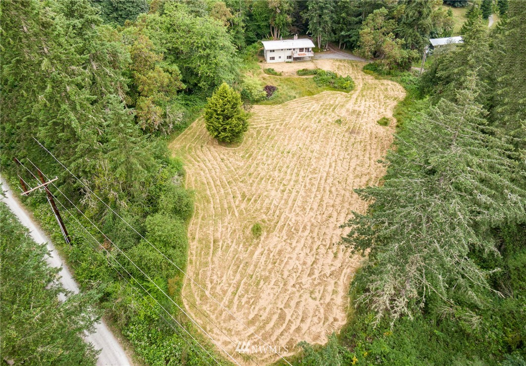 21429 Monument Road Southwest Vashon, WA 98070 - Photo 11 of 37 a view of house with yard