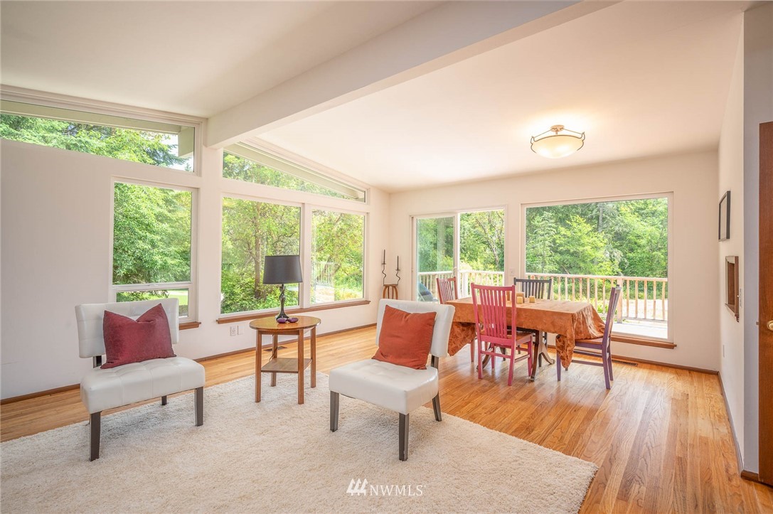 21429 Monument Road Southwest Vashon, WA 98070 - Photo 15 of 37 a living room with furniture and a wooden floor