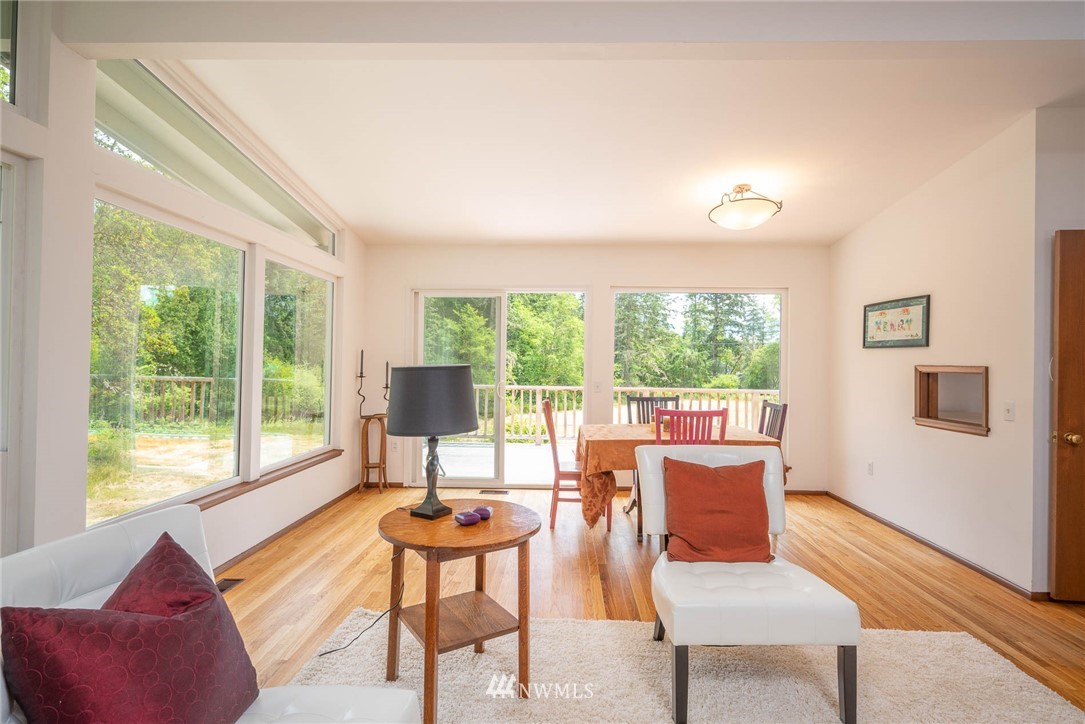 21429 Monument Road Southwest Vashon, WA 98070 - Photo 16 of 37 a living room with furniture and a window