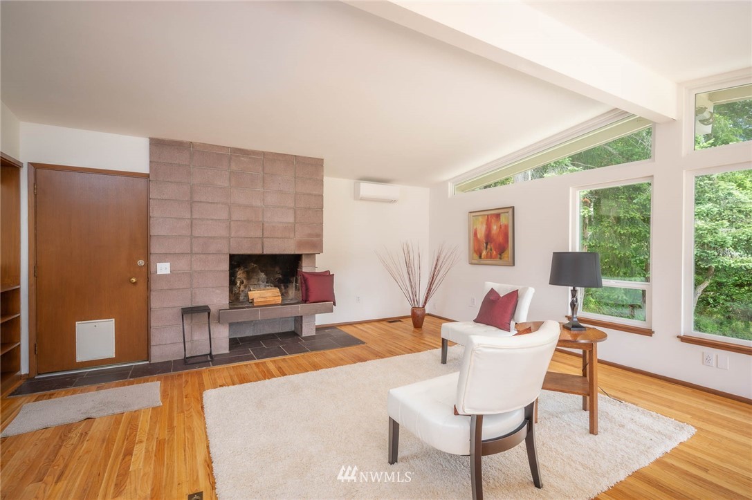 21429 Monument Road Southwest Vashon, WA 98070 - Photo 17 of 37 a living room with furniture and a fireplace