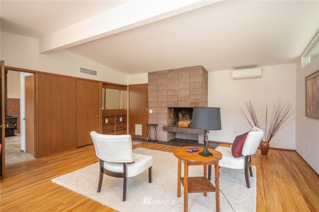 21429 Monument Road Southwest Vashon, WA 98070 - Photo 19 of 37 a living room with furniture and a wooden floor