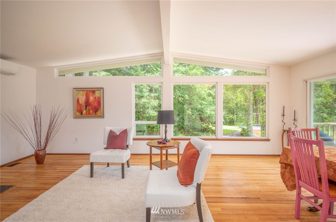 21429 Monument Road Southwest Vashon, WA 98070 - Photo 20 of 37 a living room with furniture and a large window
