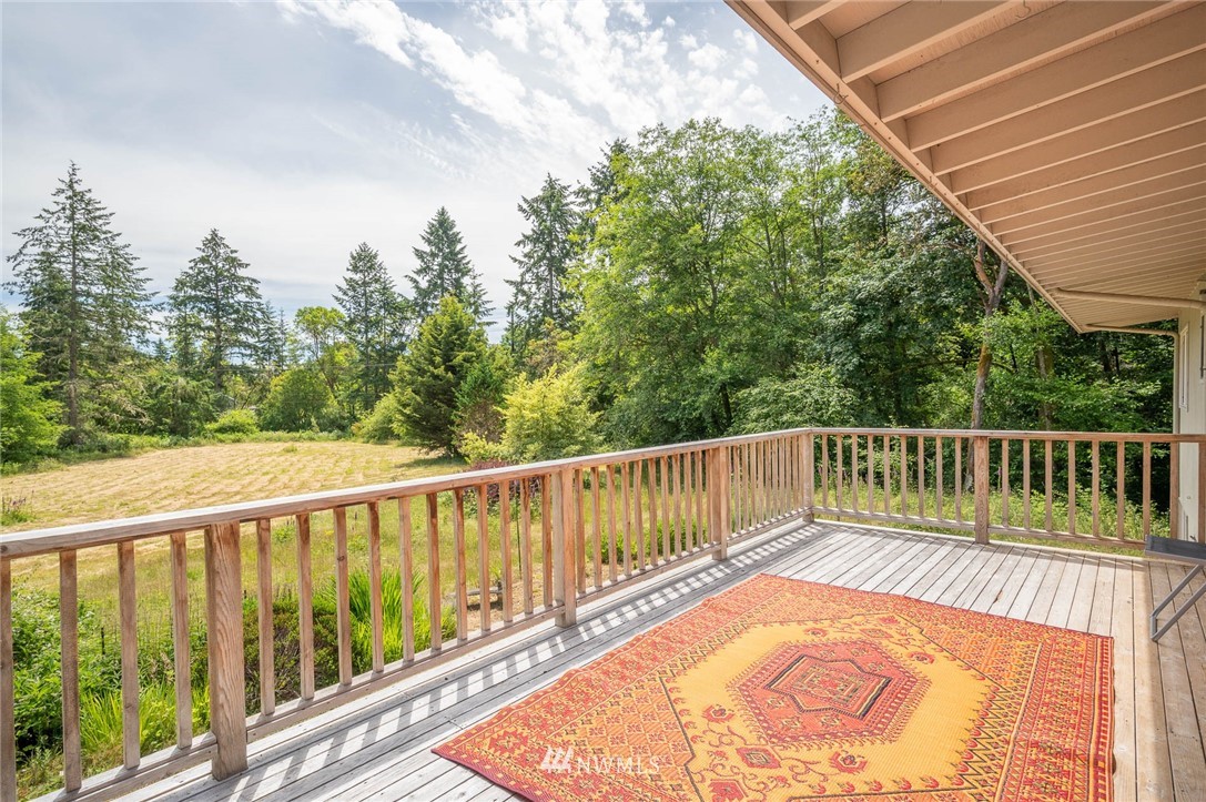 21429 Monument Road Southwest Vashon, WA 98070 - Photo 21 of 37 a view of balcony with wooden floor