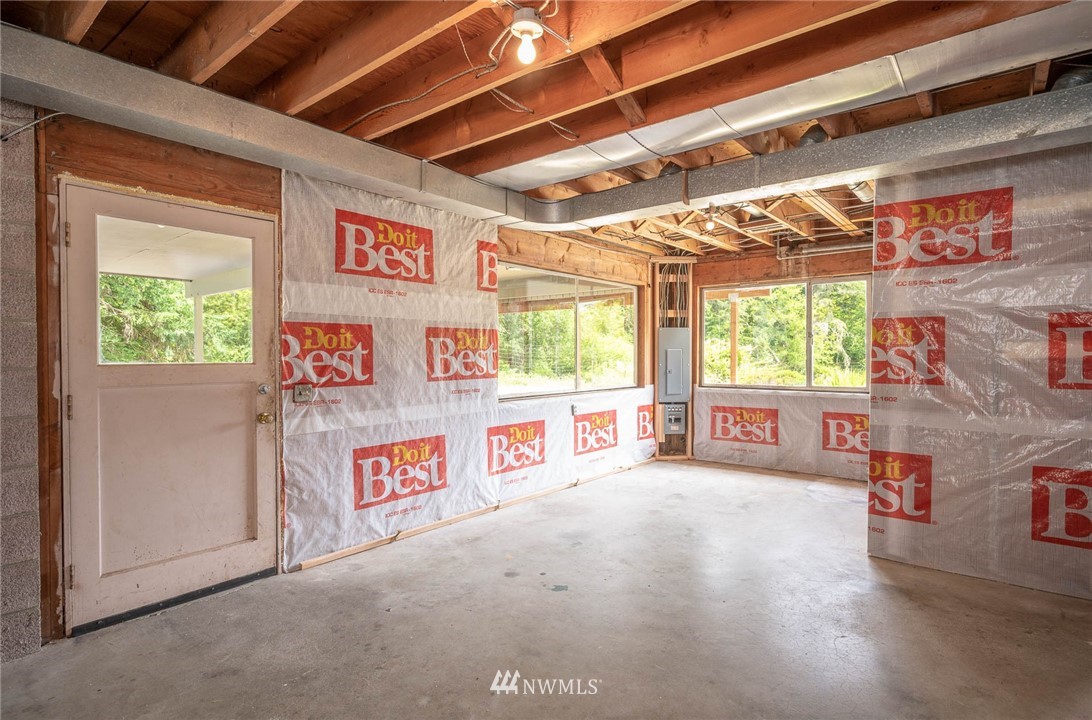 21429 Monument Road Southwest Vashon, WA 98070 - Photo 35 of 37 a view of a room with window and couch