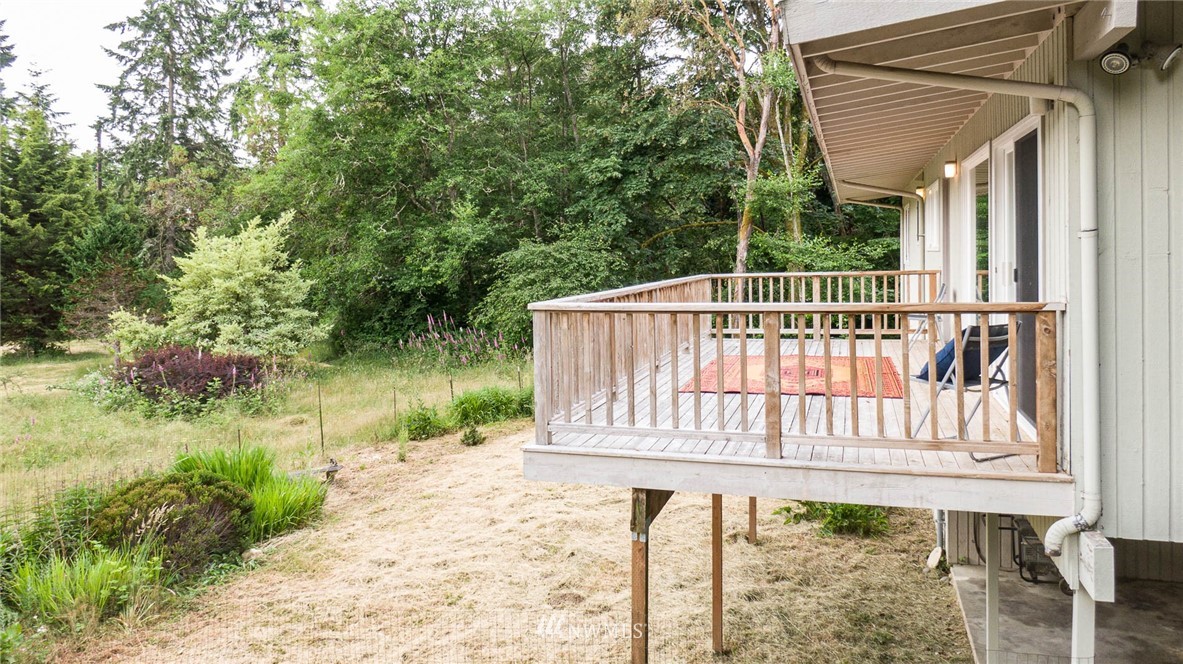 21429 Monument Road Southwest Vashon, WA 98070 - Photo 6 of 37 a view of a chair and table in the balcony