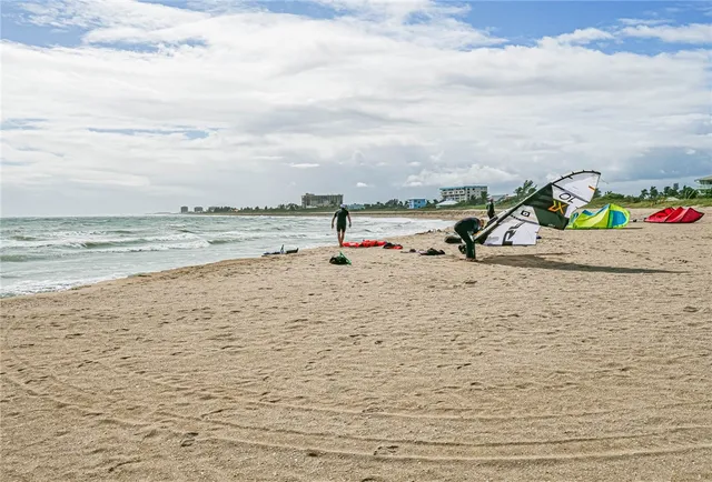 a view of a lake with houses in the back
