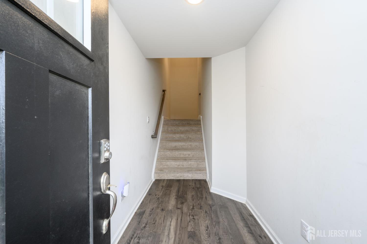 7 Foundry Blvd Mount Mount Holly, NJ 08060 - Photo 2 of 42 a view of a hallway with wooden floor and entryway