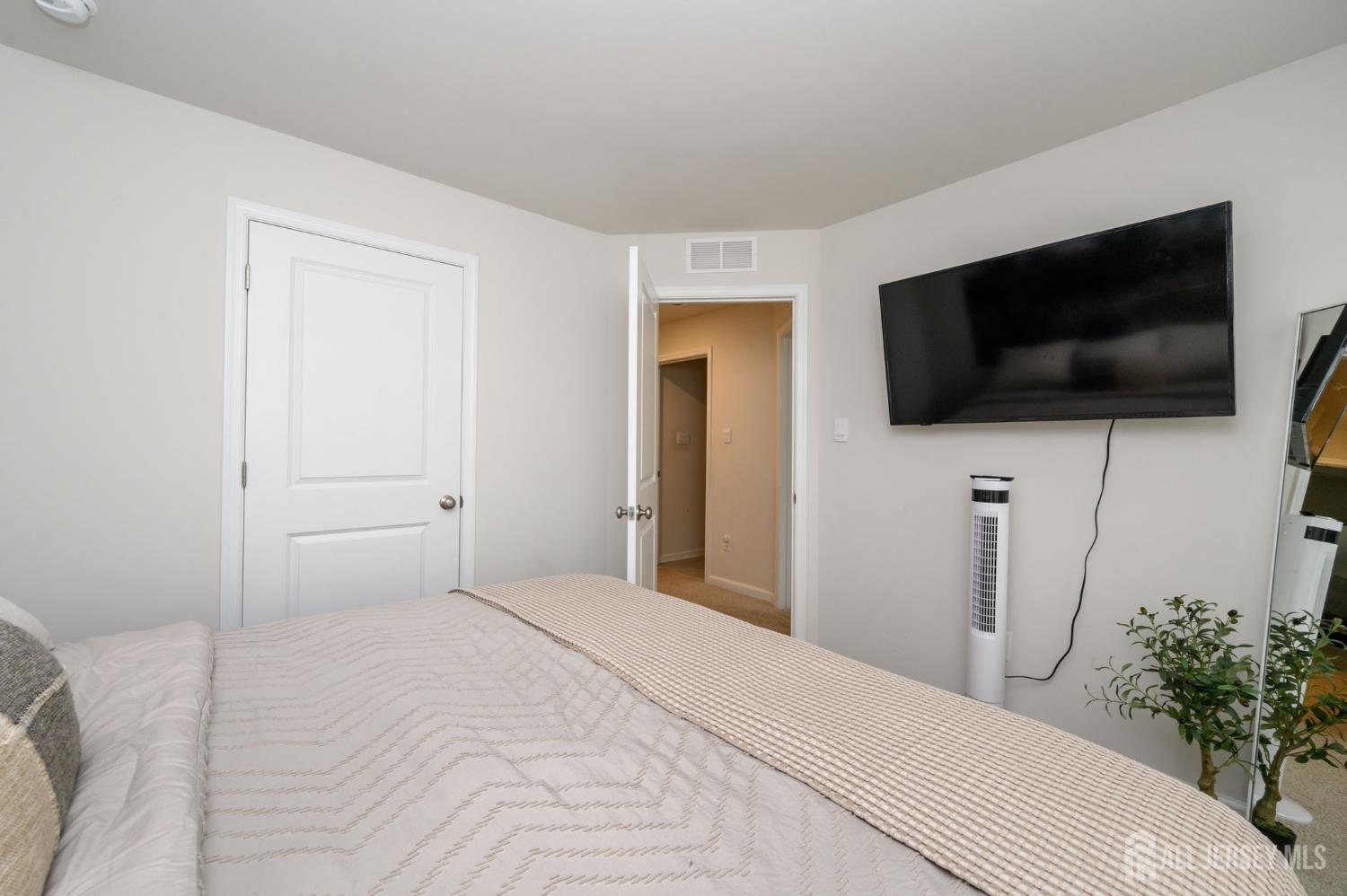 7 Foundry Blvd Mount Mount Holly, NJ 08060 - Photo 25 of 42 a bedroom with a bed and a flat screen tv
