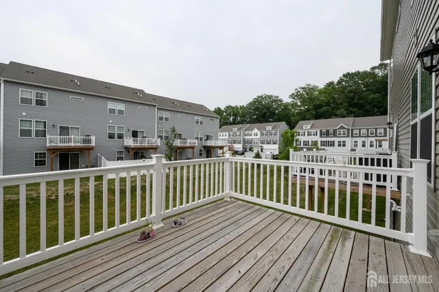 a view of balcony with deck and wooden floor